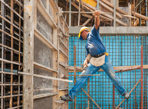 A scaffolder working with confidence knowing he has reliable Liability Insurance