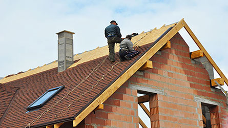 roofer working at height with personal accident cover from our Roofing Company Insurance package
