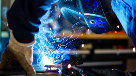 Construction worker working with high heat, covered by public liability insurance for welders